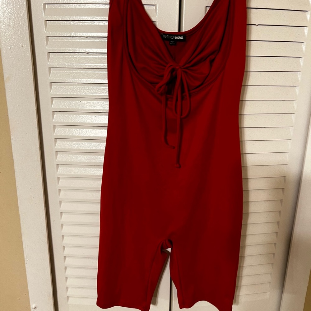 Red size small romper comes above the knee